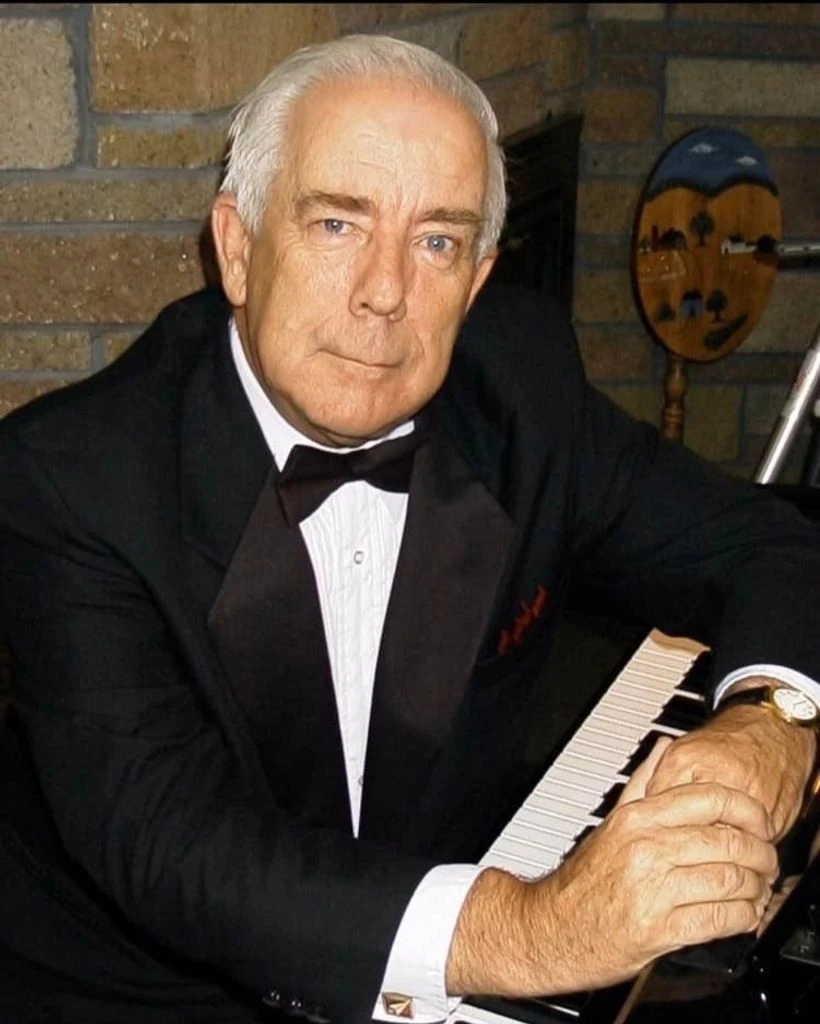 Leonard "Lenny" Hoyt seated at the piano